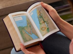 New King James Version Bible in compact paragraph-style with red letter text and cross references.