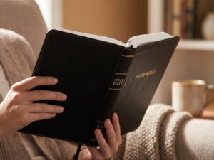 Studio photo of KJV Large Print Thinline Bible - Black Leathersoft Red Letter in lifestyle