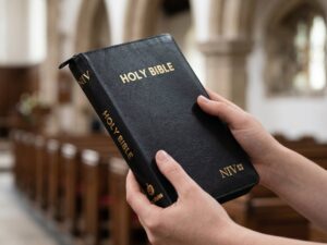 Studio photo of NIV Holy Bible Capsule With Zip, Black in lifestyle